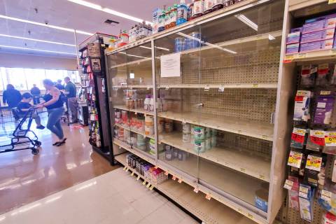 Near-empty shelves of baby formula are seen at an Albertsons grocery store on Thursday, May 12, ...