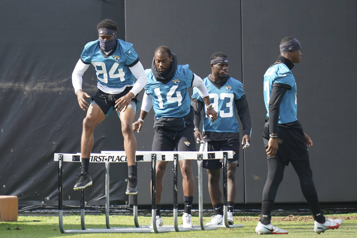 Jacksonville Jaguars players from left, wide receiver Keenan Cole (84), wide receiver Terry God ...