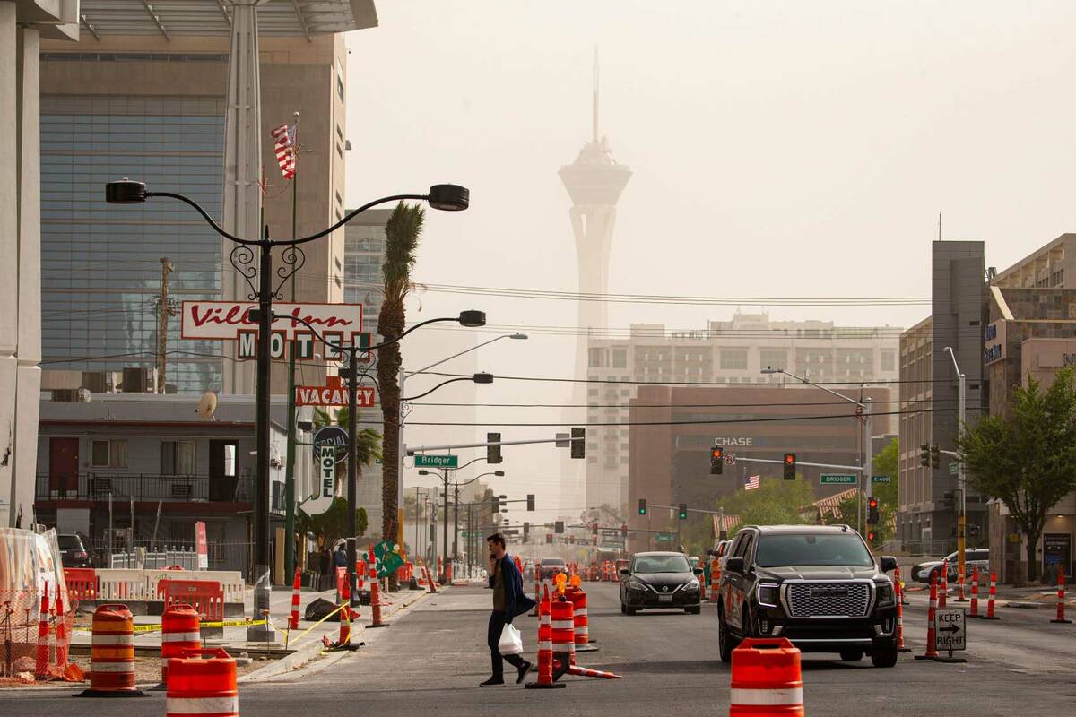 In this April 11, 2022, file photo, a pedestrian crosses Las Vegas Boulevard in downtown Las Ve ...