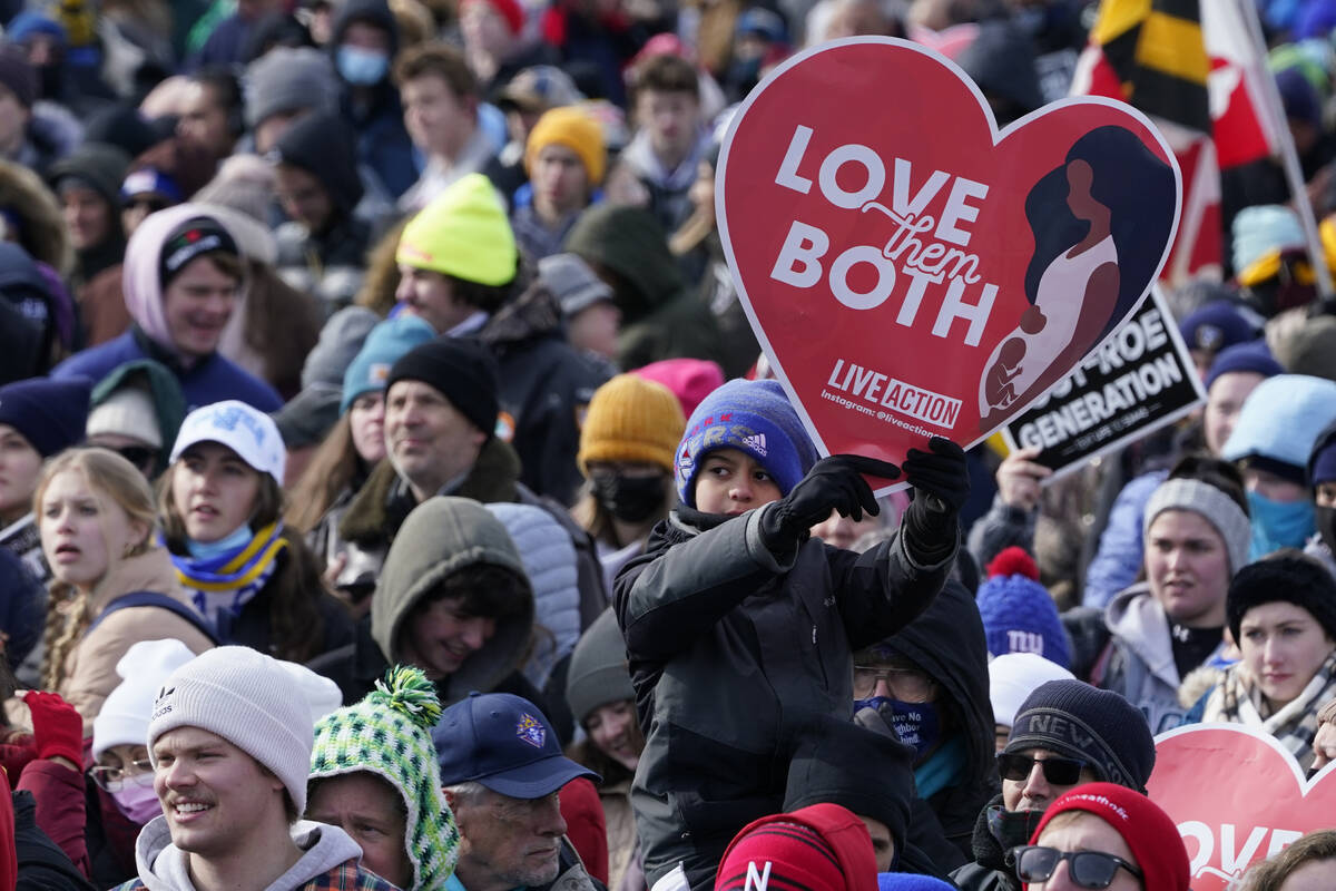People attend the March for Life rally on the National Mall in Washington, Friday, Jan. 21, 202 ...