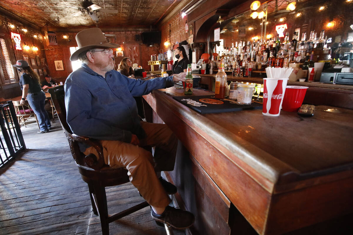 J.P. Palmer of Henderson sits at the bar in the Pioneer Saloon, Thursday, Oct. 28, 2021, in Goo ...