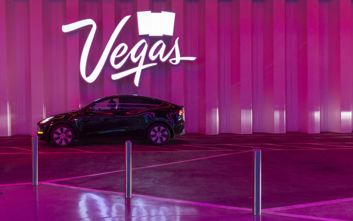 A Tesla moves through the Central Hall station underground on the Boring Company's Vegas Loop d ...
