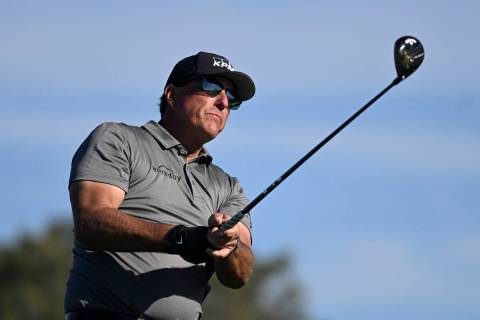 Phil Mickelson hits his tee shot on the fifth hole of the South Course at Torrey Pines during t ...
