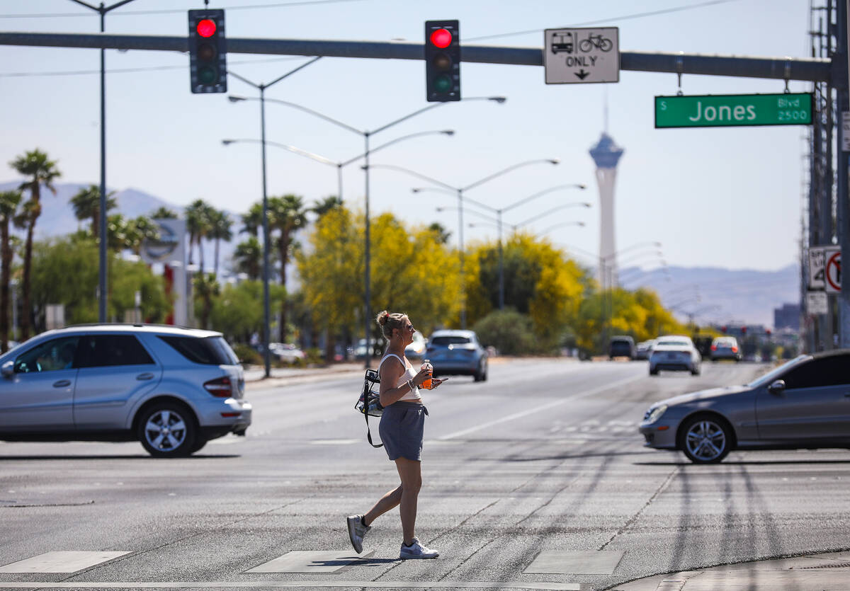 A pedestrian crosses Sahara Avenue at Jones Boulevard in Las Vegas, Sunday, May 15, 2022. Safet ...