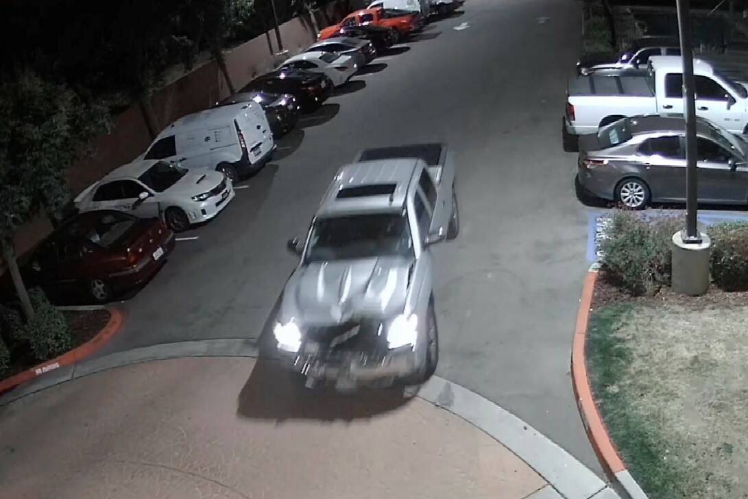 This surveillance video image shows a pickup truck that struck a woman leaving a hotel parking ...