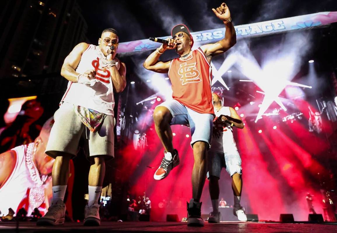 Chingy, right, joins Nelly onstage during the Lovers & Friends music festival on Saturday, ...