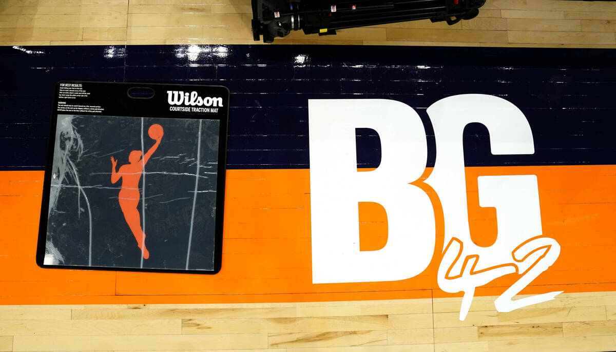 A floor decal in front of the scorer's table pays tribute to Phoenix Mercury's Brittney Griner ...