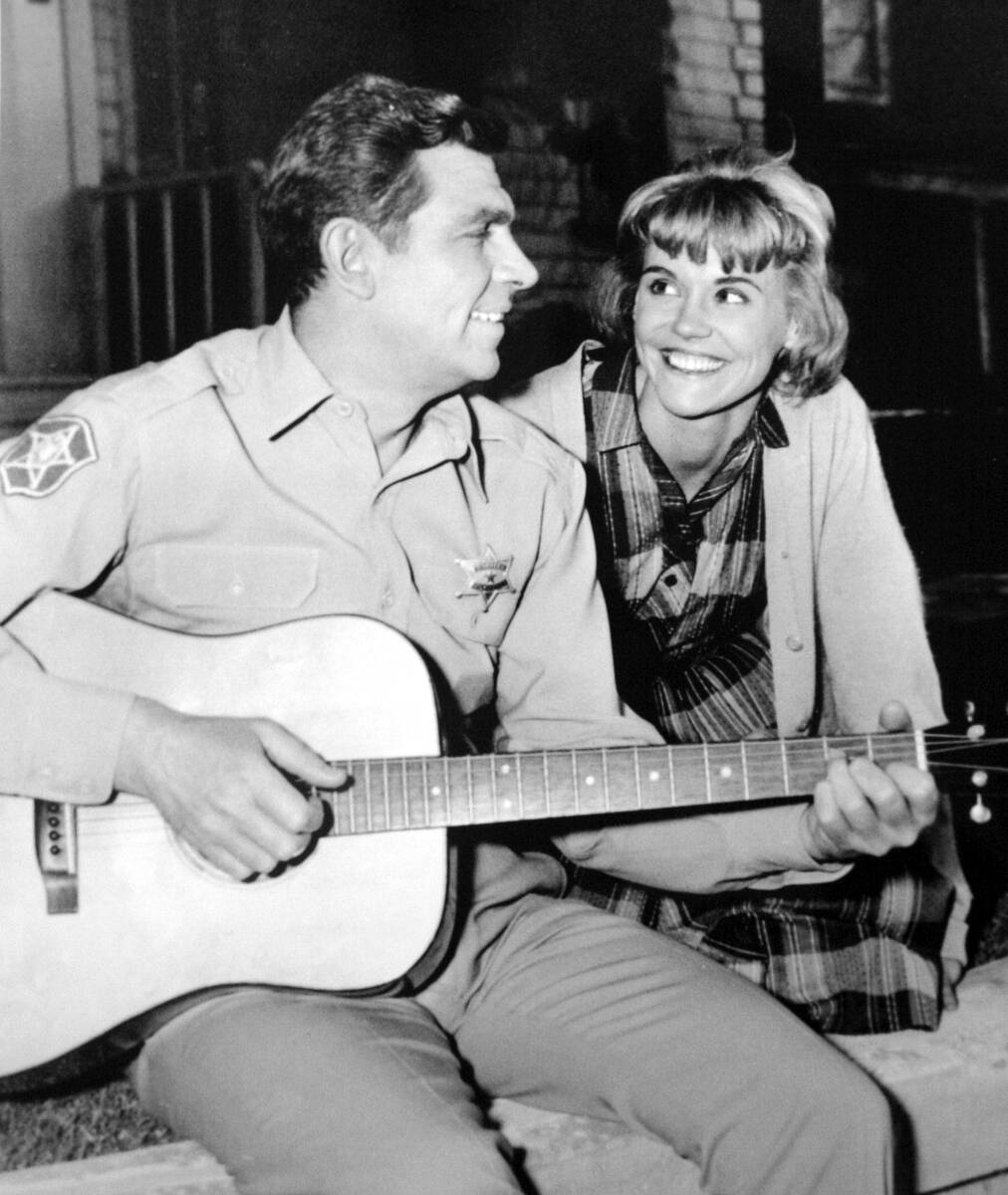 Actor/comedian Andy Griffith playing himself, left, strums his guitar with his TV girlfriend Ch ...
