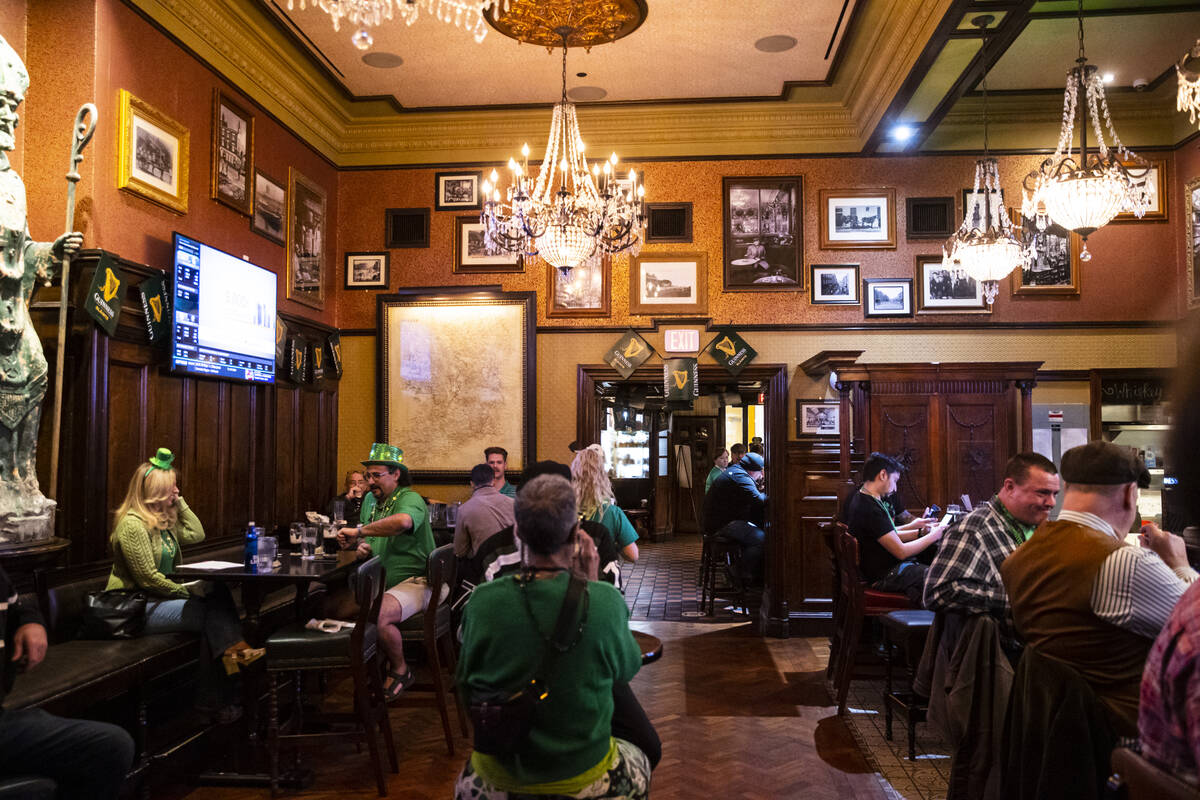 People gather at Ri Ra Irish Pub at the Shoppes at Mandalay Place in Las Vegas on Wednesday, Ma ...