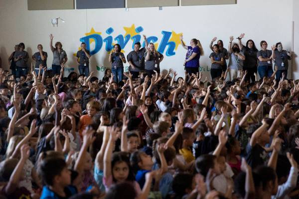 Students and faculty participate during a ceremony at Divich Elementary School in Las Vegas, wh ...