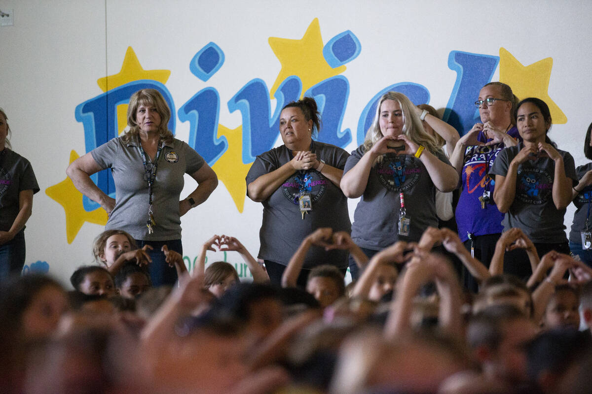 Students and faculty participate during a ceremony at Divich Elementary School in Las Vegas, wh ...