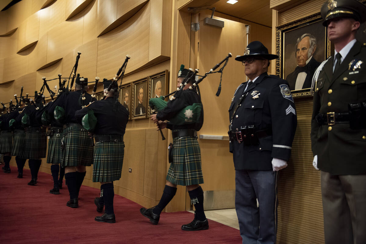 Members of the Las Vegas Emerald Society Pipe Band enter the Las Vegas City Council Chambers fo ...