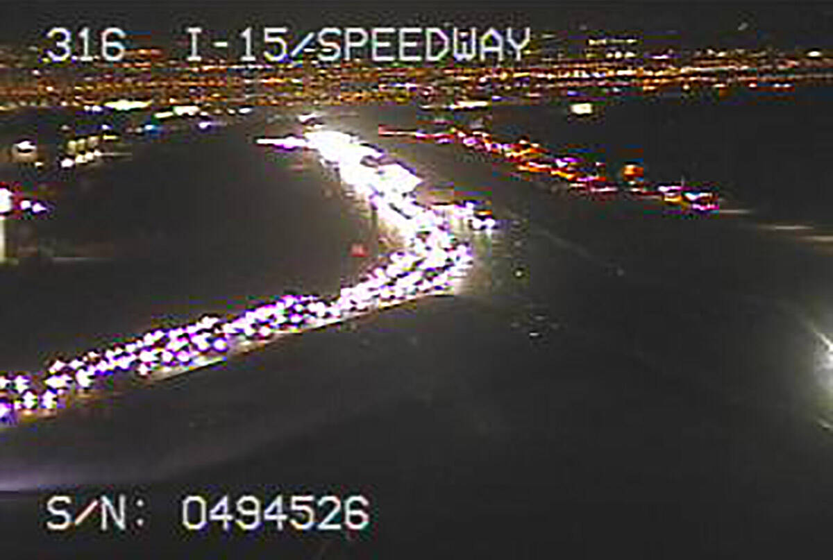 Northbound Interstate 15 traffic headed to the Electric Daisy Carnival at Speedway Boulevard ab ...