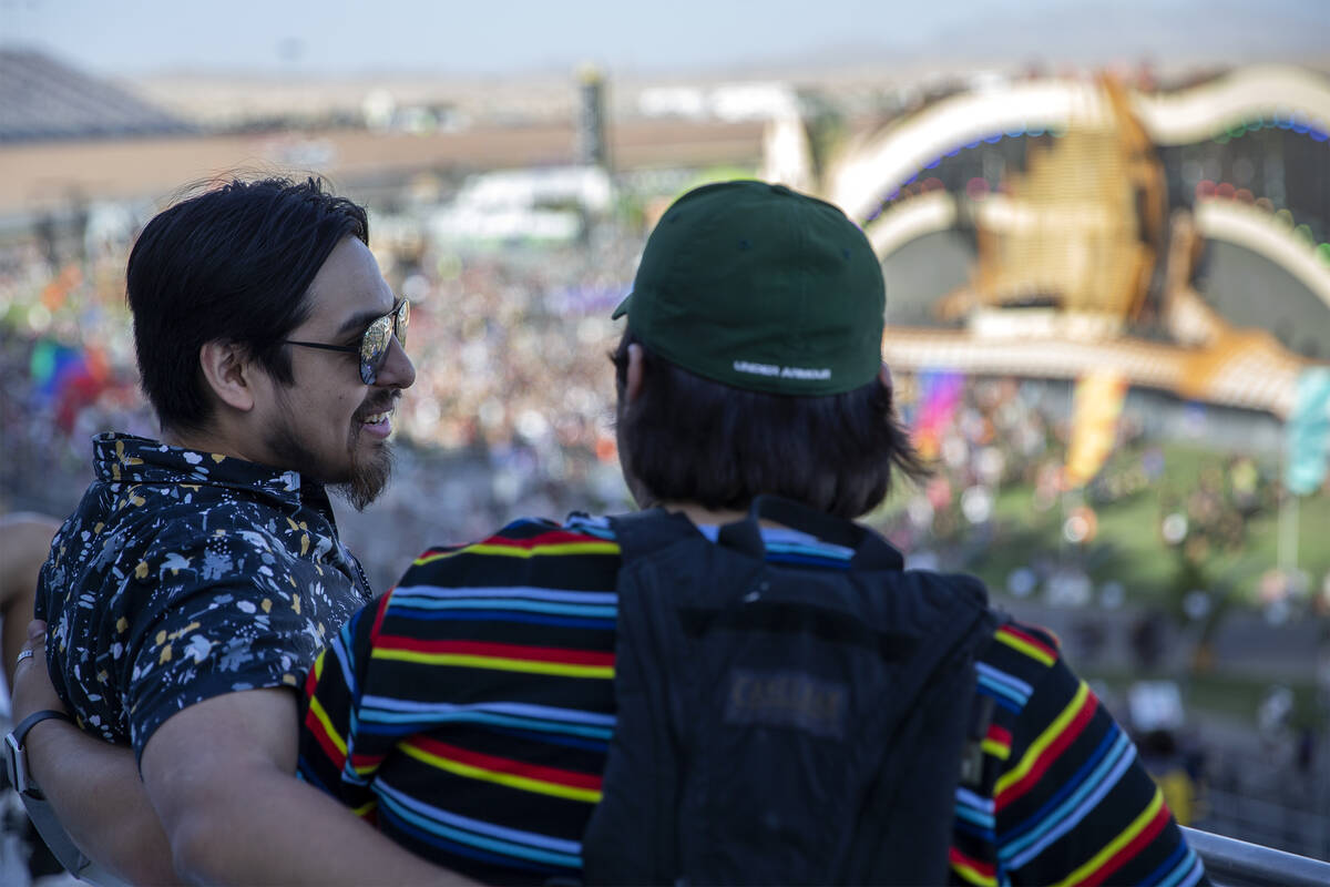 An attendee who declined to give his name takes a seat overlooking the festival grounds during ...