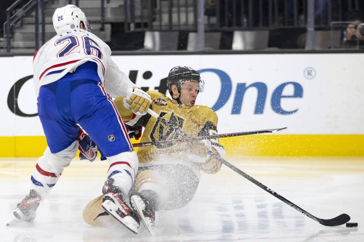 Golden Knights right wing Evgenii Dadonov (63) falls while taking a shot on goal as Canadiens d ...
