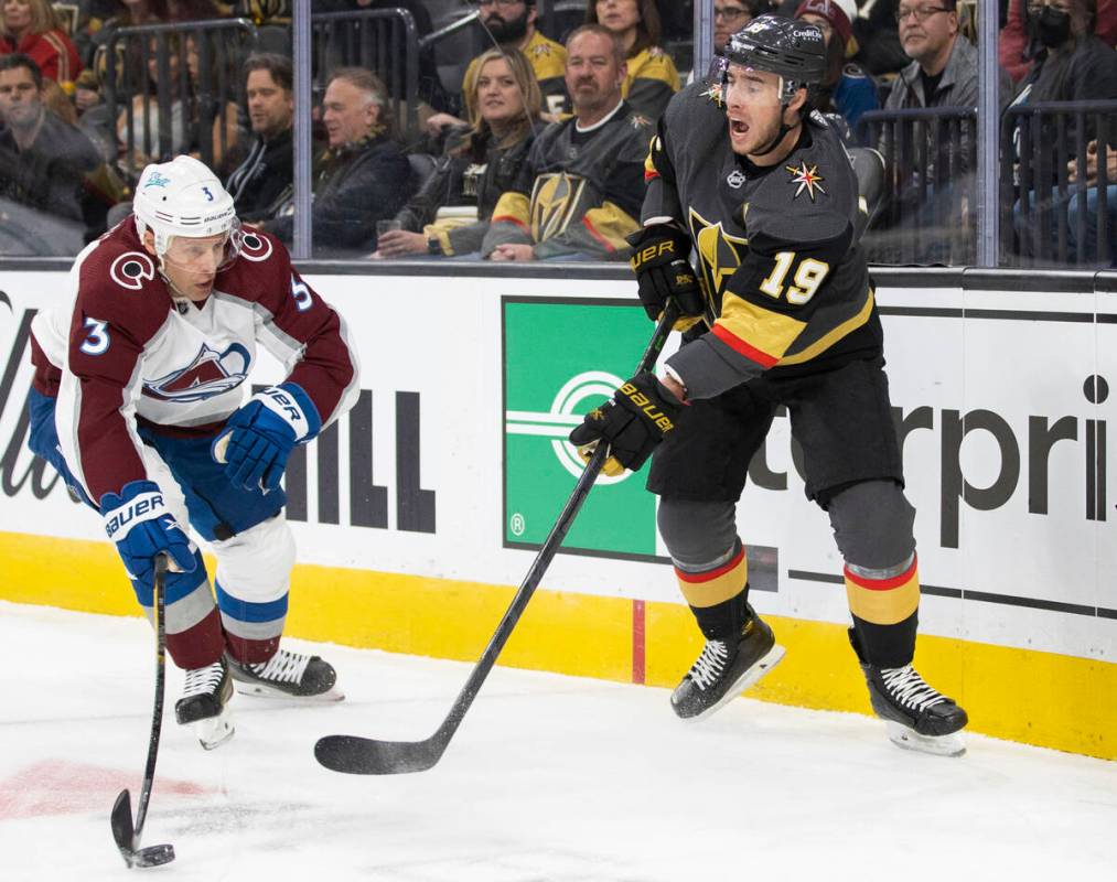 Golden Knights right wing Reilly Smith (19) makes a pass around Colorado Avalanche defenseman J ...