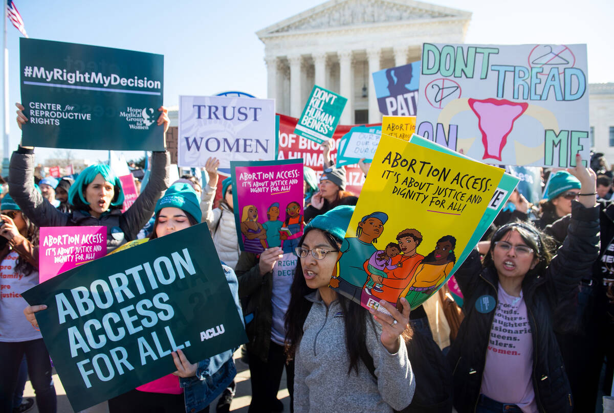Pro-choice activists supporting legal access to abortion protest during a demonstration outside ...