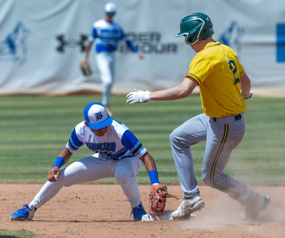 Basic short stop Ty Southisene (3) makes a tag late as Bishop Manogue runner Joey Scolari (2) a ...