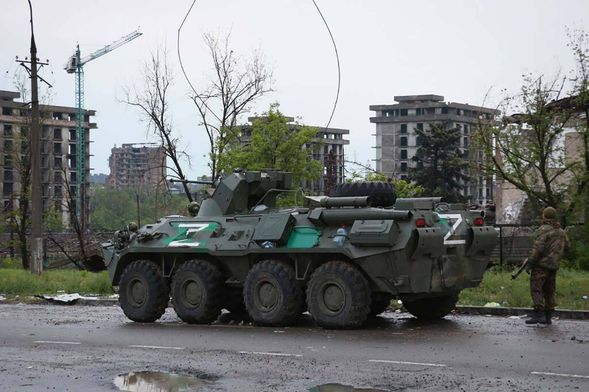 An APC of Donetsk People's Republic militia stands not far from Mariupol's besieged Azovstal st ...