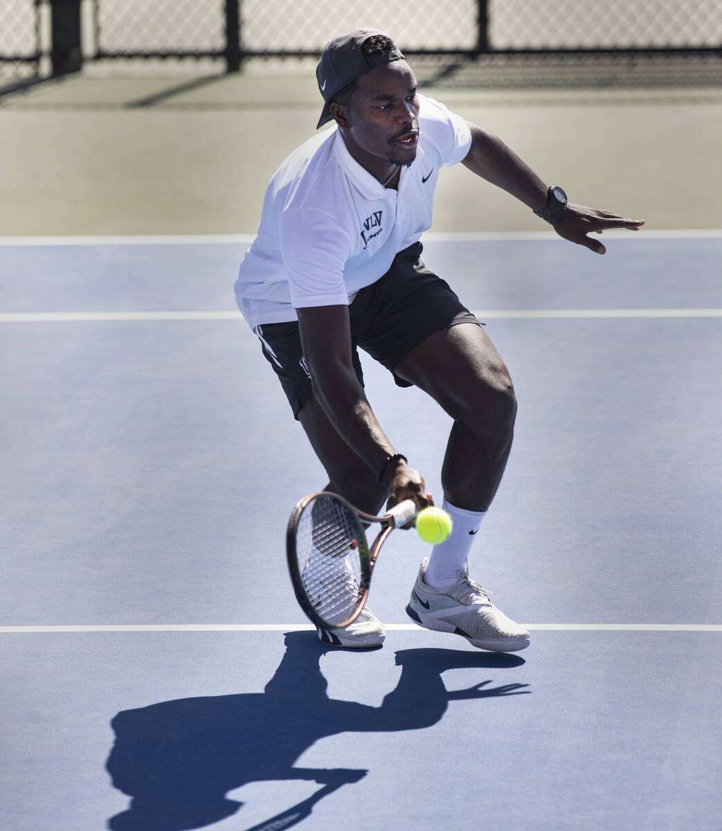 UNLV senior tennis player Christopher Bulus returns the ball during practice at Frank and Vicki ...