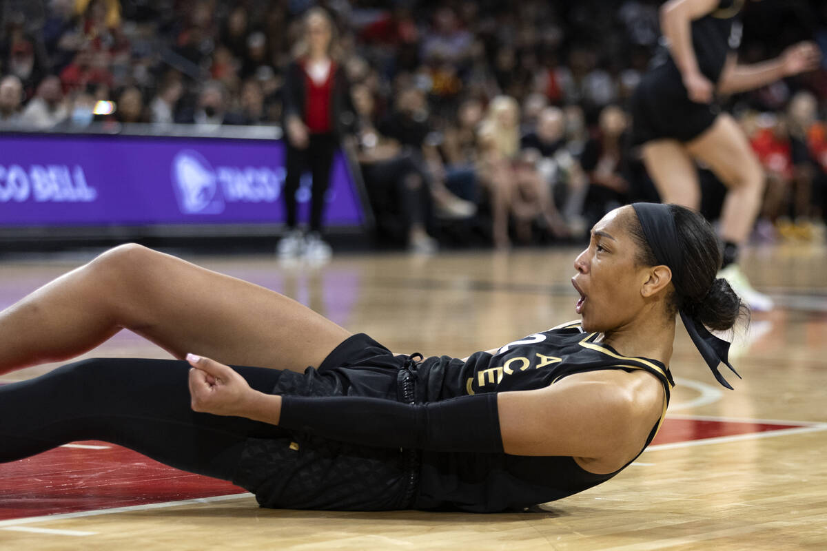 Las Vegas Aces forward A'ja Wilson (22) reacts as he falls to the court after making a basket d ...