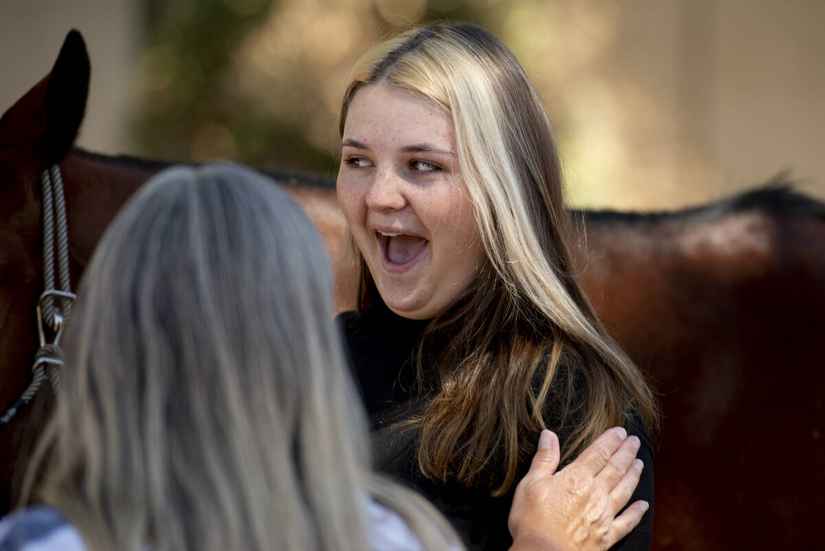 Bailey King, 17, cries tears of joy after being gifted her own horse on Saturday, May 21, 2022, ...