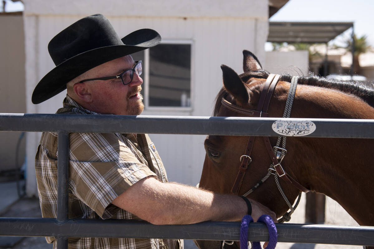 Mike King, Bailey's father, holds the new horse, Sierra, gifted to Bailey by Make-A-Wish Southe ...