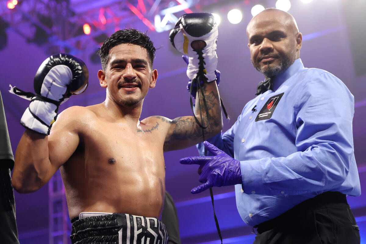 Jessie Magdaleno poses after his unanimous decision win against Edy Valencia Mercado in a feath ...