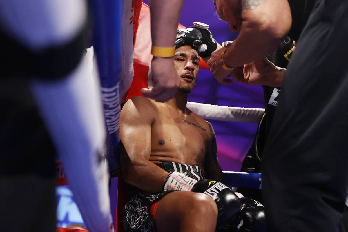 Jessie Magdaleno sits on his corner at the end of the seventh round of the featherweight bout a ...
