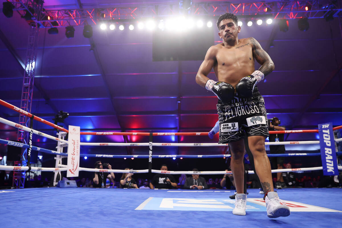 Jessie Magdaleno walks to his corner at the end of the seventh round of the featherweight bout ...