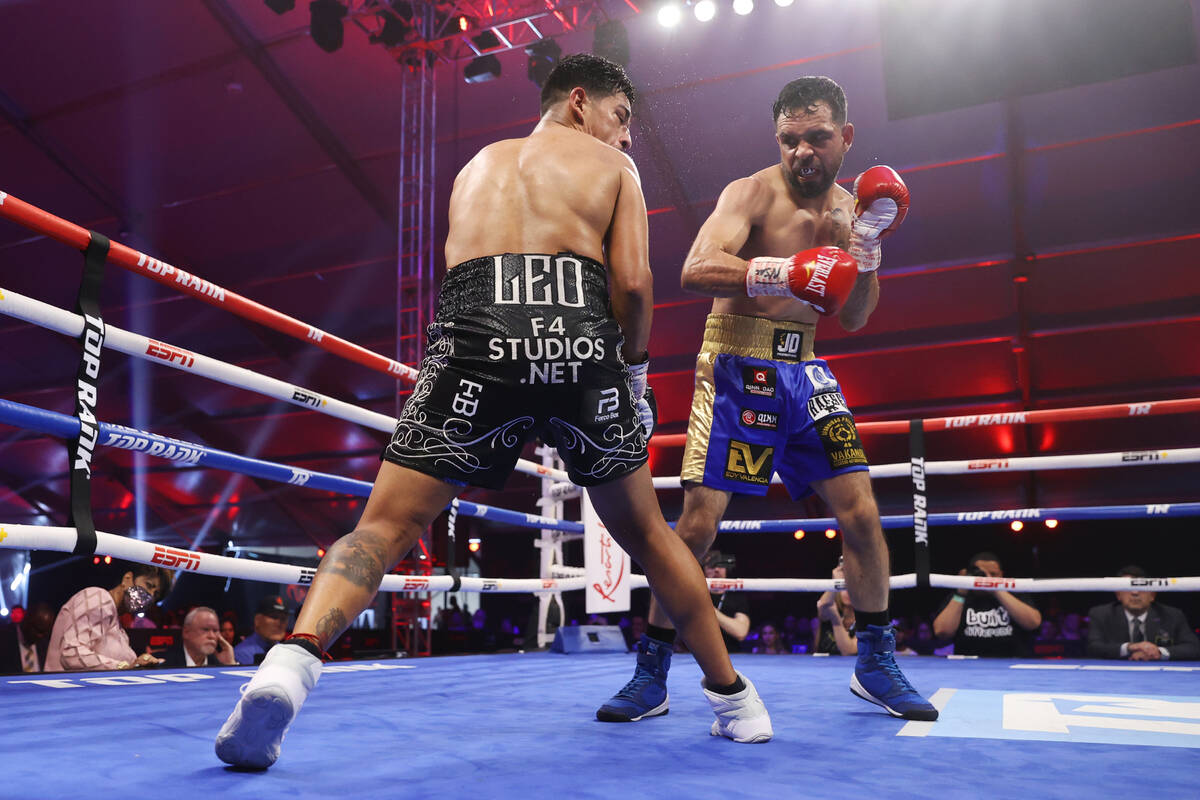 Edy Valencia Mercado, right, connects a punch against Jessie Magdaleno in the sixth round of th ...