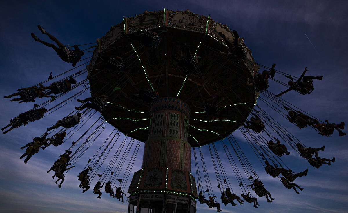 Attendees ride the swing during day three of Electric Daisy Carnival on Sunday, May 22, 2022, a ...