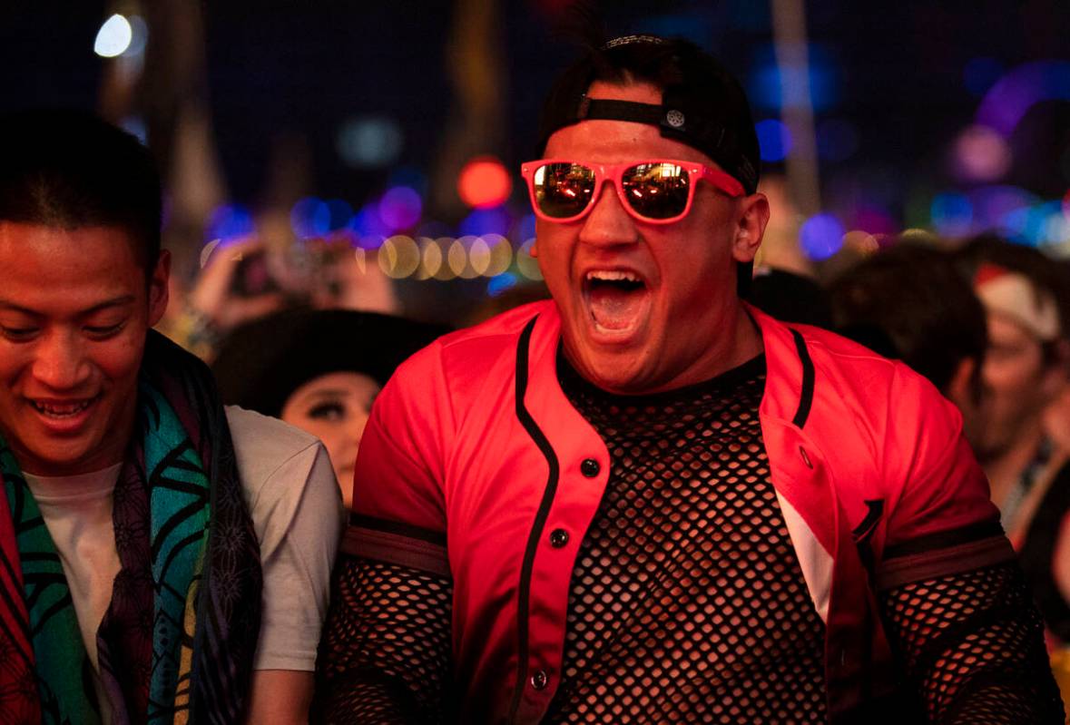 Attendees listen to music at Base Pod during day three of Electric Daisy Carnival on Sunday, Ma ...