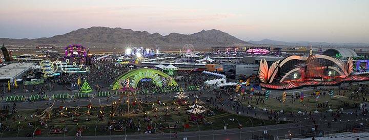 Attendees of the Electric Daisy Carnival file in as the sun sets over the Las Vegas Motor Speed ...