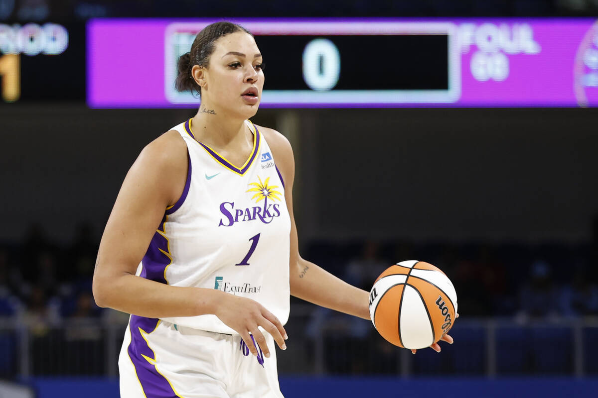 Los Angeles Sparks center Liz Cambage brings the ball up court against the Chicago Sky during t ...