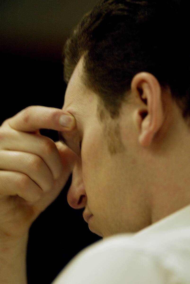 Timmy "T.J." Weber rubs his eyebrow while the coroner testifies about how Kim Gautie ...