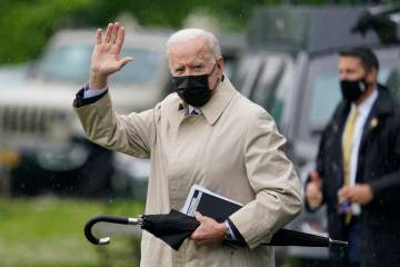 President Joe Biden waves as he walks to Marine One on the Ellipse near the White House, Friday ...
