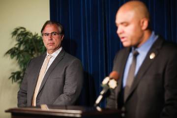 FBI Assistant Special Agent in Charge Ray Johnson listens as Metropolitan Police Department Lt. ...