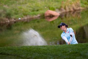 Ally Ewing hits out of the bunker at the 17th hole during the championship round of the Bank of ...