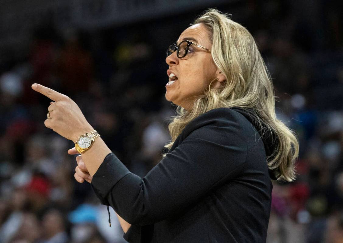 Aces head coach Becky Hammon directs her team in the first half during a WNBA basketball game a ...