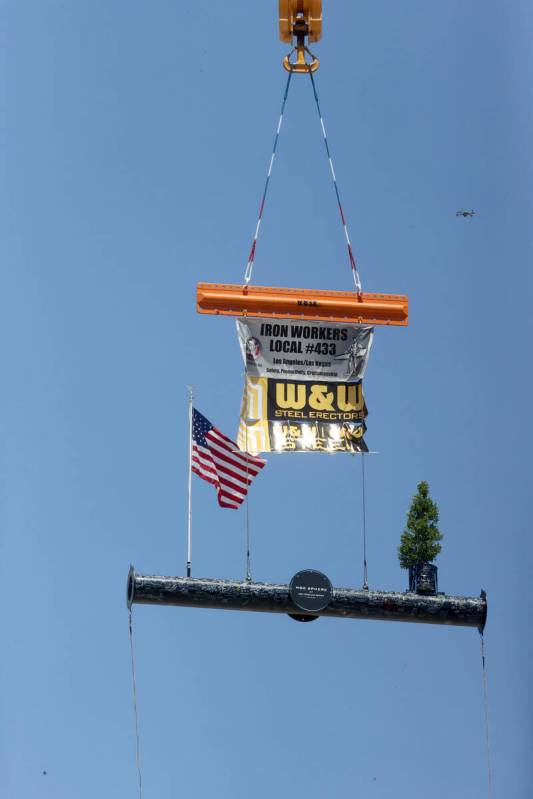 The final beam is raised to be placed at the top of the MSG Sphere at The Venetian during a top ...