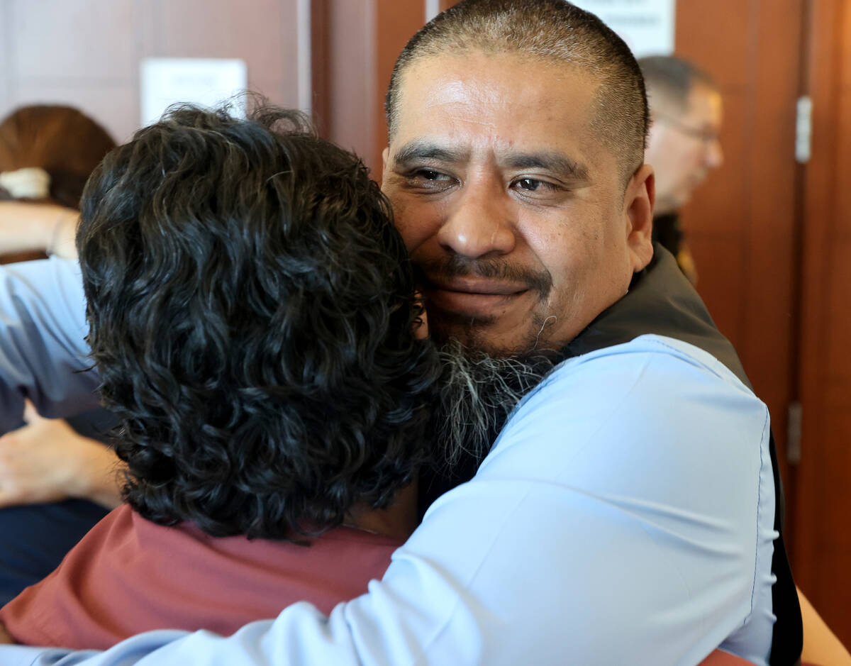 Ivan Arenas, father of Marcos Arenas, hugs his stepmother Anna Arenas after a guilty verdict in ...