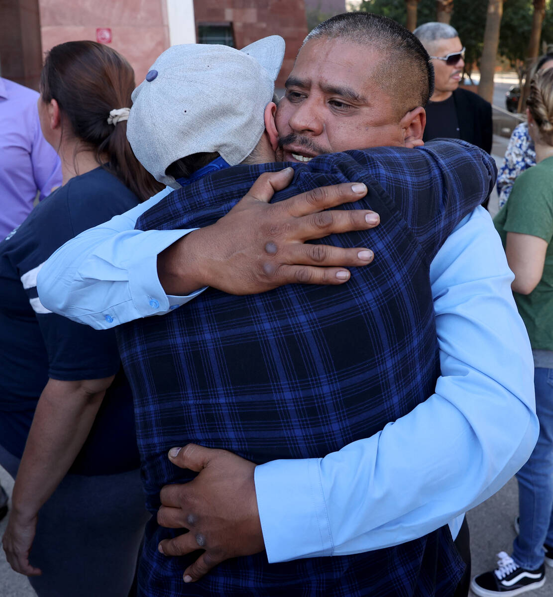 Ivan Arenas, father of Marcos Arenas, hugs his son Omar Arenas after a guilty verdict in the re ...