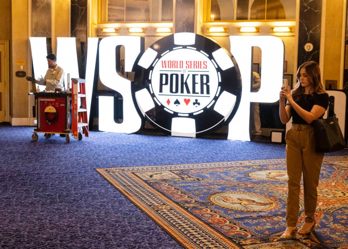 David Hemby, a carpenter, installs the WSOP sign at Paris Las Vegas on Thursday May 26, 2022, i ...