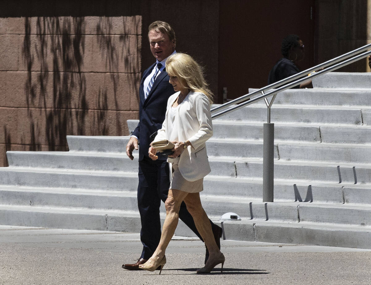 Former Raiders coach Jon Gruden and his wife, Cindy, leave the Regional Justice Center after ap ...