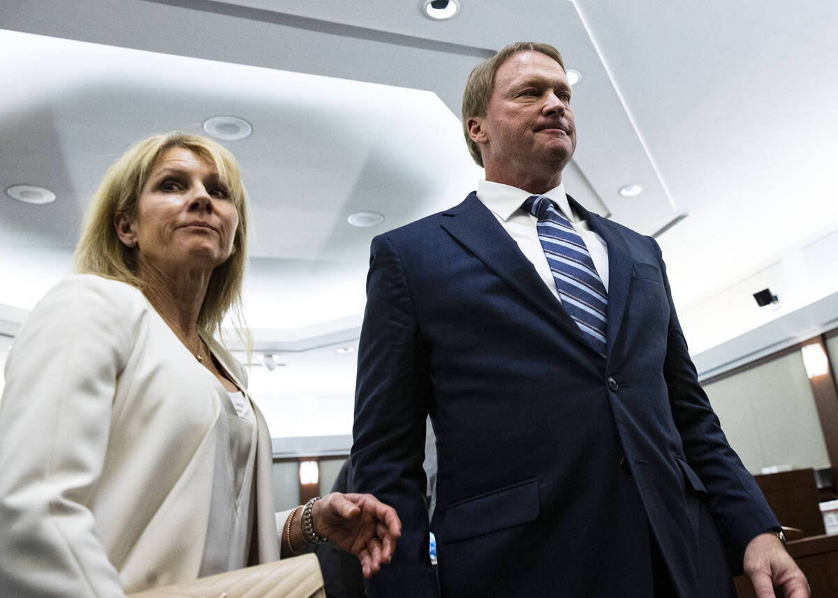 Former Raiders coach Jon Gruden and his wife, Cindy, leave the courtroom after appearing at a h ...