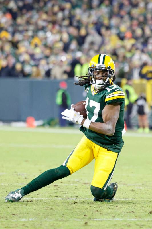 Green Bay Packers wide receiver Davante Adams (17) runs after a catch during an NFL divisional ...