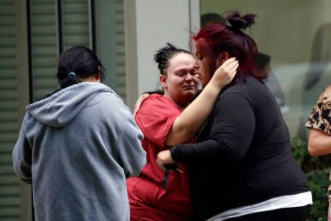 People react outside the Civic Center in Uvalde, Texas, Tuesday, May 24, 2022. An 18-year-old g ...