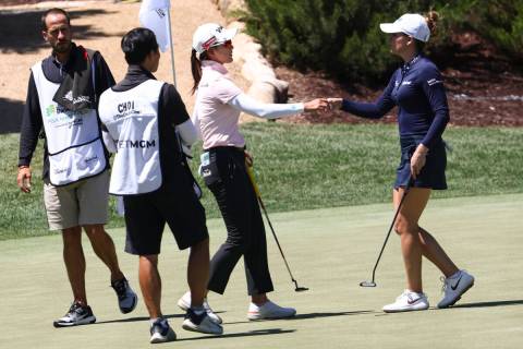 Gaby Lopez, right, and Chella Choi react Lopez defeated her at the 13th hole in the first round ...