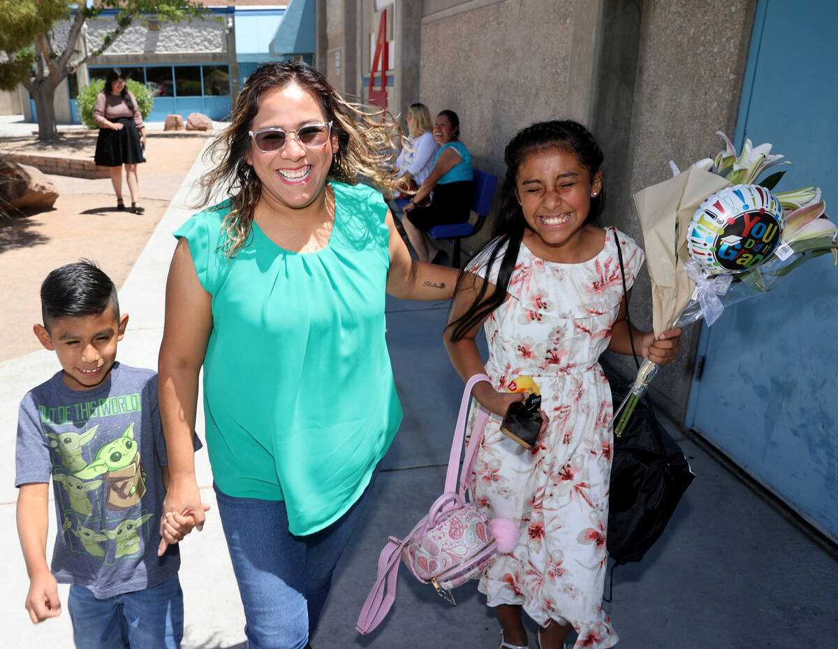 Fifth grade graduate Grace Cordova with her mother Areli and Brother Alexander, 8, on the last ...